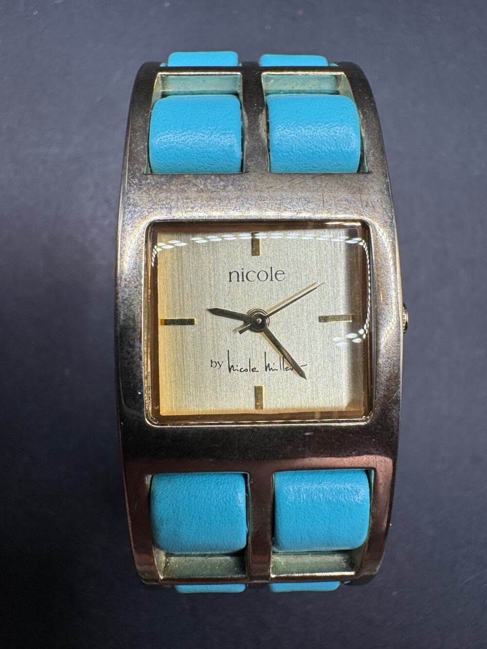 Nicole Miller Quartz Watch Gold Tone w/ Soft Turquoise Leather Cuff Working